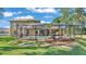 Spacious backyard showcasing a beautiful screened-in pool and outdoor entertaining area of the home at 6774 Crescent Woods Cir, Lakeland, FL 33813
