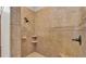 Tiled shower with decorative accent border and two showerheads at 6774 Crescent Woods Cir, Lakeland, FL 33813