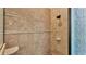 Close-up of the stand up shower featuring neutral tile with a decorative border and built in soap dish at 6774 Crescent Woods Cir, Lakeland, FL 33813