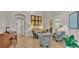 Comfortable sitting room with four chairs, tile floors, and ample natural light at 6774 Crescent Woods Cir, Lakeland, FL 33813