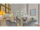 Comfortable sitting room with four chairs and bright, neutral decor at 6774 Crescent Woods Cir, Lakeland, FL 33813