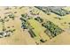 Wide aerial view of the neighborhood highlighting large grassy plots, scattered houses, and mature trees at 6981 Snell Rd, Bartow, FL 33830