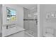 Modern bathroom featuring glass-enclosed shower, quartz countertop and cabinet storage, offering comfort and style at 6981 Snell Rd, Bartow, FL 33830