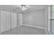 Bright bedroom with tile floors, double closets and natural light from the window at 6981 Snell Rd, Bartow, FL 33830