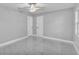 Inviting bedroom featuring gray walls, tile flooring, and a bright, airy atmosphere at 6981 Snell Rd, Bartow, FL 33830