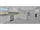 A spacious kitchen with white cabinetry, tiled floors, updated appliances and open concept design at 6981 Snell Rd, Bartow, FL 33830