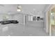 Open concept living space with dining, living room, and kitchen; features marble floors at 6981 Snell Rd, Bartow, FL 33830