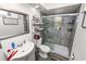 Bathroom with sink, toilet and a shower with glass doors at 7324 Thomas Jefferson E Cir, Bartow, FL 33830