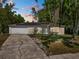 Charming single-story home with a two-car garage, solar panels, and a well-maintained front lawn at 7324 Thomas Jefferson E Cir, Bartow, FL 33830
