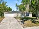 Well-maintained single-story home featuring a two-car garage, solar panels, and a spacious driveway at 7324 Thomas Jefferson E Cir, Bartow, FL 33830