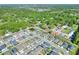 Aerial view of the neighborhood featuring tree-lined streets, well-manicured lawns, and similar single-Gathering homes at 7445 Ibis Dr, Lakeland, FL 33810