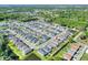 Expansive aerial view of a residential neighborhood with lush green spaces and well-maintained homes, including the property indicated at 7445 Ibis Dr, Lakeland, FL 33810