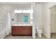 A clean bathroom features double sinks, a shower/tub combo, and a bright vanity area at 7445 Ibis Dr, Lakeland, FL 33810