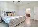 A bright bedroom features light gray floor, with bathroom access at 7445 Ibis Dr, Lakeland, FL 33810
