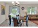 A modern dining area with a view to the outside and stylish light fixture at 7445 Ibis Dr, Lakeland, FL 33810