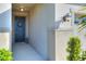 Welcoming entryway featuring a stylish front door with wreath and ambient lighting at 7445 Ibis Dr, Lakeland, FL 33810