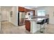 Modern kitchen with stainless steel appliances, granite countertops, and an island at 7445 Ibis Dr, Lakeland, FL 33810