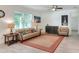 Inviting living room filled with natural light, features a comfortable seating area at 7445 Ibis Dr, Lakeland, FL 33810