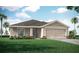 Charming one-story home featuring neutral color palette, well-manicured lawn, and inviting entrance at 7576 Sw 108 Th St, Ocala, FL 34476