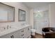 Modern bathroom featuring double sinks and a glass-enclosed shower at 900 Saddlewood Blvd, Lakeland, FL 33809