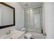 Clean bathroom with a shower-tub combo and vanity at 900 Saddlewood Blvd, Lakeland, FL 33809