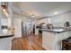 Kitchen with stainless steel appliances, white cabinets, and bar-style seating at 900 Saddlewood Blvd, Lakeland, FL 33809