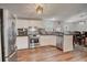 Bright kitchen with stainless steel appliances and wood-look flooring at 900 Saddlewood Blvd, Lakeland, FL 33809