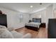 Comfortable main bedroom with wood-look flooring and a ceiling fan at 900 Saddlewood Blvd, Lakeland, FL 33809