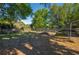 Fenced backyard featuring trees, grass and plenty of space at 1116 Durham Dr, Lakeland, FL 33809