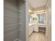 Bathroom featuring a vanity area and closet space providing a functional and organized space for personal care items at 1116 Durham Dr, Lakeland, FL 33809