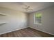 This bedroom is bright with lots of natural light, wood floors and a ceiling fan at 1116 Durham Dr, Lakeland, FL 33809