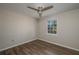 Bedroom showcasing wood floors, a ceiling fan, a window with natural light and neutral paint at 1116 Durham Dr, Lakeland, FL 33809