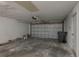 Spacious garage featuring a door opener and ample room for vehicles and storage at 1116 Durham Dr, Lakeland, FL 33809