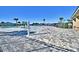 Community pool with beach style entrance and plenty of room for lounge chairs on a sunny day at 1537 Leamington Ln, Winter Haven, FL 33884