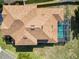 Aerial view of a home featuring a private pool and an expansive roof with updated shingles at 181 James Cir, Lake Alfred, FL 33850