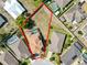 Aerial view of home outlined in red on a large lot with pool and other homes at 181 James Cir, Lake Alfred, FL 33850