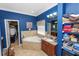 Elegant bathroom with a soaking tub, tile accents, and vanity with ample counter space at 181 James Cir, Lake Alfred, FL 33850