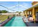 Inviting screened-in pool and patio area perfect for outdoor relaxation and entertaining at 181 James Cir, Lake Alfred, FL 33850
