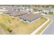 Aerial view of the home exterior with well-maintained lawn in a residential neighborhood at 2983 Flying Blackbird Rd, Bartow, FL 33830