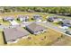 Aerial view of a home in a planned community featuring manicured lawns and paved streets at 2983 Flying Blackbird Rd, Bartow, FL 33830