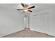 Bedroom featuring neutral carpet, a ceiling fan, and a closet with white bi-fold doors at 2983 Flying Blackbird Rd, Bartow, FL 33830