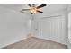 Bedroom featuring neutral carpet, a ceiling fan, and a closet with white bi-fold doors at 2983 Flying Blackbird Rd, Bartow, FL 33830