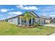 Charming single-story home featuring a well-manicured lawn, two-car garage, and neutral gray color scheme at 2983 Flying Blackbird Rd, Bartow, FL 33830