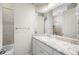 Bathroom features granite countertops, white cabinetry, and a tiled shower/bath at 2997 Mission Lakes Dr, Lakeland, FL 33803