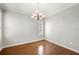 Bright dining room boasts hardwood floors, a chandelier, and plantation shuttered window at 2997 Mission Lakes Dr, Lakeland, FL 33803
