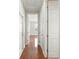 Hallway featuring hardwood floors and doorways leading to other rooms in the home at 2997 Mission Lakes Dr, Lakeland, FL 33803