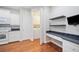 Efficient eat-in kitchen boasts white appliances, granite countertops, and laundry access at 2997 Mission Lakes Dr, Lakeland, FL 33803