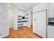 Efficient eat-in kitchen boasts white appliances, granite countertops, and access to the dining space at 2997 Mission Lakes Dr, Lakeland, FL 33803