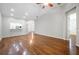 Hardwood floors flow through the expansive, airy living room with bright, neutral walls at 2997 Mission Lakes Dr, Lakeland, FL 33803