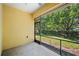 Screened patio overlooking well-maintained landscaping and mature trees at 2997 Mission Lakes Dr, Lakeland, FL 33803